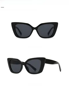 Front and side view of modern black cat-eye sunglasses with dark grey UV lenses