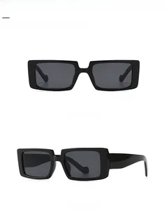 Front and 45 degree side view of retro black rectangular sunglasses with grey lenses