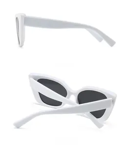 Side and back view of white cat-eye sunglasses featuring thick frames and dark lenses