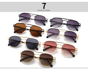 Detailed collection of seven vintage double-bridge sunglasses with slim metal frames and varied lenses
