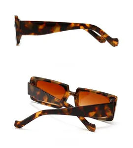 Detail view of retro tortoiseshell sunglasses with thick frames and dark brown lenses