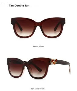 Détail de lunettes de soleil tan oversize avec charnière en strass et verres dégradés