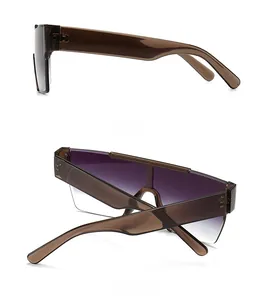 Detail view of brown acetate frames and purple gradient lenses on retro flat top sunglasses