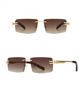 Detail showing rimless rectangle sunglasses with gold metal frame and gradient brown lenses