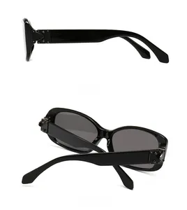 Detail view of retro square sunglasses with wide temples and silver rivet hinges