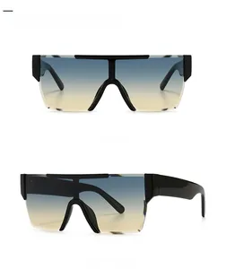 Flat top shield sunglasses featuring blue to tan gradient lenses and black frames