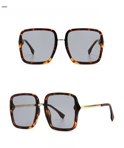 Detail of leopard print square sunglasses with silver lenses and gold metal accents