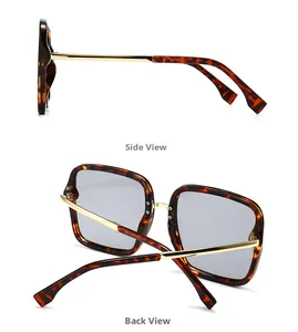 Detail view showing tortoise shell frame and gold metal hinges of square sunglasses