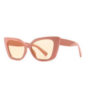 Retro cat-eye sunglasses with pink frames and yellow lenses in a modern vintage style
