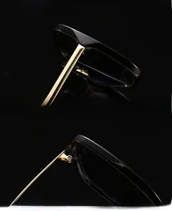 Detailed view of reinforced metal hinges and UV protection lenses on black sunglasses