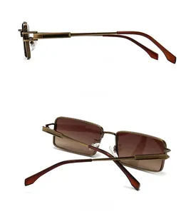 Detail view showing bronze metal frame and dark brown gradient lenses of retro sunglasses