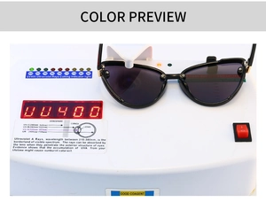 Detail of black cat-eye sunglasses undergoing a UV400 protection functional test