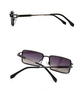 Detail view of rectangular metal frames with purple gradient lenses and nose pads