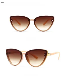 Front and 45-degree side view of light pink cat-eye sunglasses with gradient tan lenses