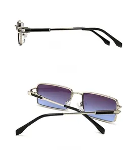 Detail view of gold metal rectangle sunglasses showing side and back design features