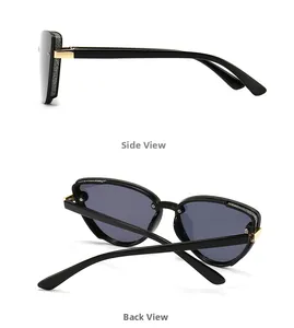 Detail view of cat-eye sunglasses with silver glitter accents and gold metal hinges
