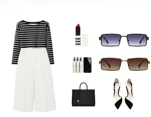 Flat lay of modern rectangle sunglasses paired with a striped top and white trousers