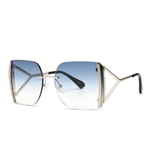 Lunettes de soleil rétro carrées avec verres dégradés bleus et branches géométriques dorées