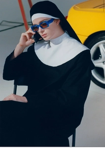Detail of retro rectangle sunglasses with blue acetate frame and yellow tinted lenses