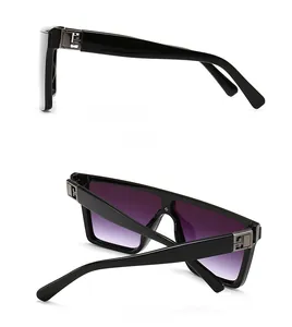 Detail view of square black frames with purple gradient lenses and silver hollow hinge