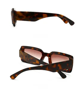Detail view of retro tortoise shell sunglasses showing side profile and back folding design