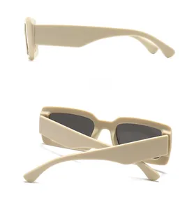 Detailed side and back view of retro beige rectangular sunglasses with dark grey lenses