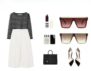 Flat lay of retro wide leg sunglasses styled with a striped top and fashion accessories