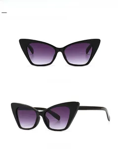 Front and 45 degree side view of vintage black cat-eye sunglasses with gradient lenses