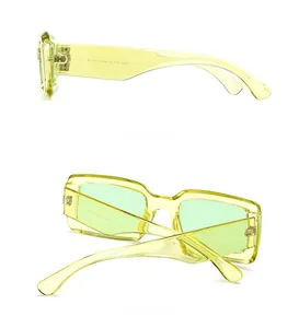 Detail view of yellow transparent rectangular sunglasses showing inner temple and S3080 code