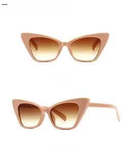 Detail view of narrow cat-eye sunglasses in light pink with double tan gradient lenses