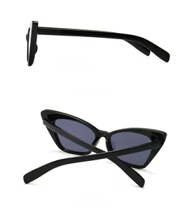 Side and back view of retro narrow cat-eye sunglasses with thick black frame and grey lenses