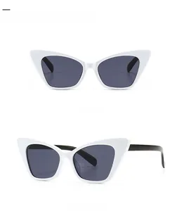 Detailed views of narrow white cat eye sunglasses with grey lenses from front and 45 degree angles