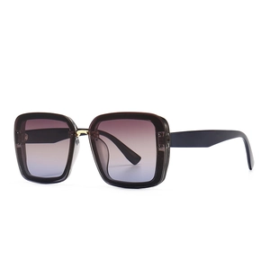 Modern oversized square sunglasses with purple-blue gradient lenses and gold metal accents