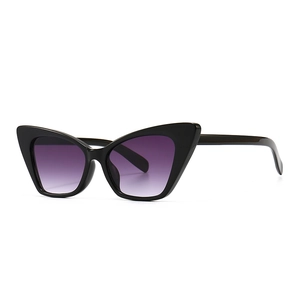 Retro cat-eye sunglasses with black frame and purple gradient lenses for fashion-forward women