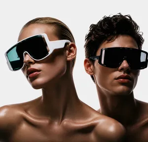 Close-up of oversized mask sunglasses featuring wide temples and metallic rivet details