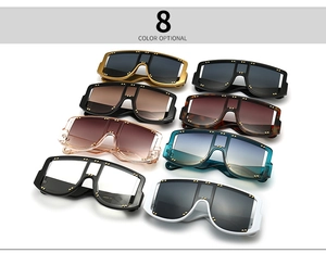 Detailed display of oversized shield sunglasses in eight various colors with rivet accents