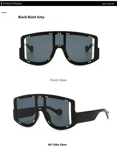 Detail view of large frame oversized sunglasses with golden studded rivets on black frame