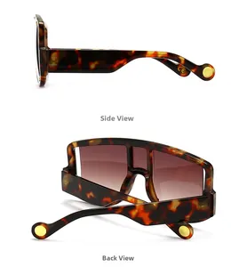 Detail view of tortoiseshell mask sunglasses with gold rivets and CE marking