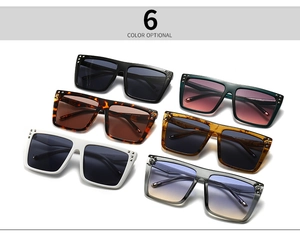 Detail shot of square oversized sunglasses showing metal rivets and various frame colors