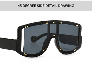 Detailed 45-degree side view of large black sunglasses with gold rivet embellishments