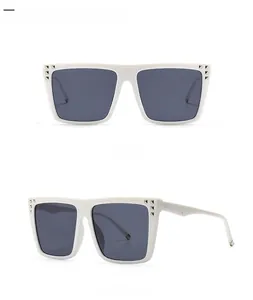 Front and side views of white square sunglasses with silver rivets and grey lenses