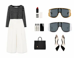 Flat lay of oversized rivet sunglasses styled with a striped top and white wide-leg pants