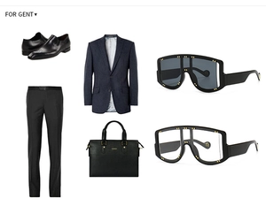 Flat lay of retro oversized shield sunglasses with gold rivets and men's formal business suit