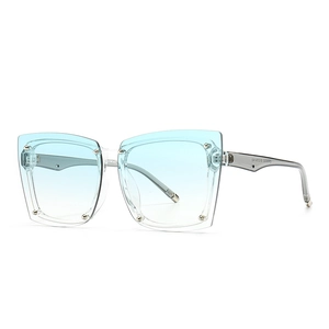 Square oversized sunglasses with light blue gradient lenses and transparent frames