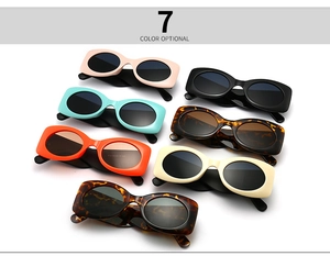 Multiple stylish oval sunglasses displayed in seven trendy colors with thick retro frames