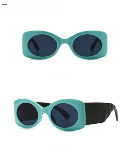 Detailed front and side views of retro cyan wide frame sunglasses with grey lenses