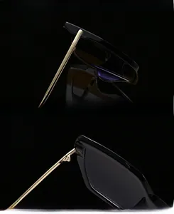 Detail of reinforced UV400 lenses and smooth gold metal hinges on large frame sunglasses