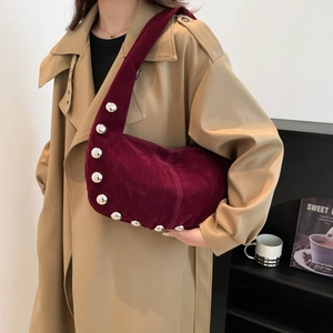 Retro burgundy suede hobo bag with large silver studs and spacious minimalist design