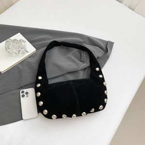 Retro black suede crescent bag with silver rivet studs and a spacious shoulder strap