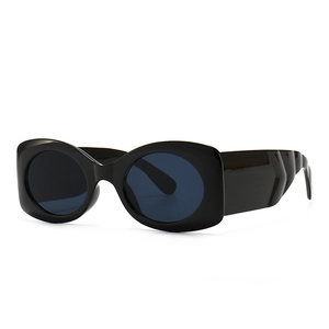 Retro black thick frame sunglasses with oval lenses and unique V-shaped textured wide temples